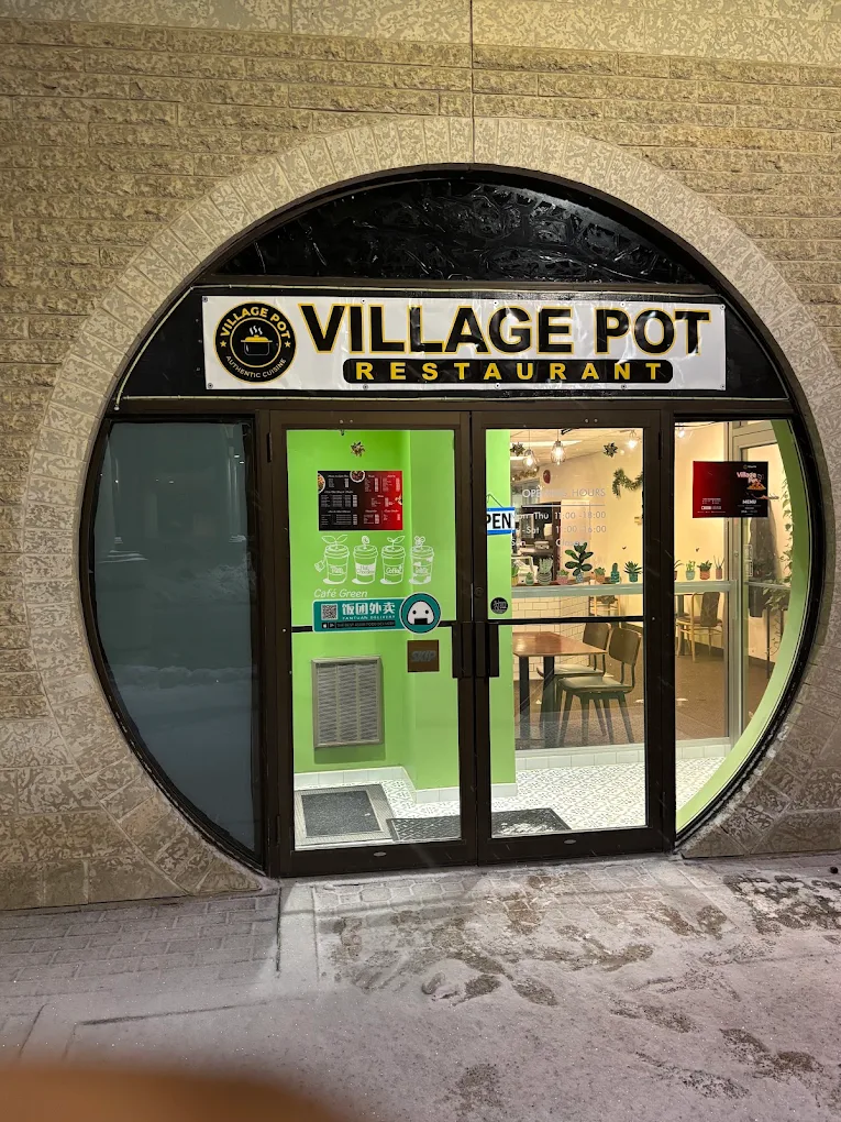 White rice with stew and 1 pc meat in rich West African spices at Village Pot downtown Winnipeg